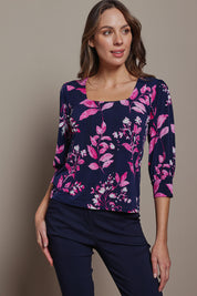 Model Madeline wearing size 10 of The Printed Square Neck Blouse in colour Nightpetal (Blue), from the front, cropped image