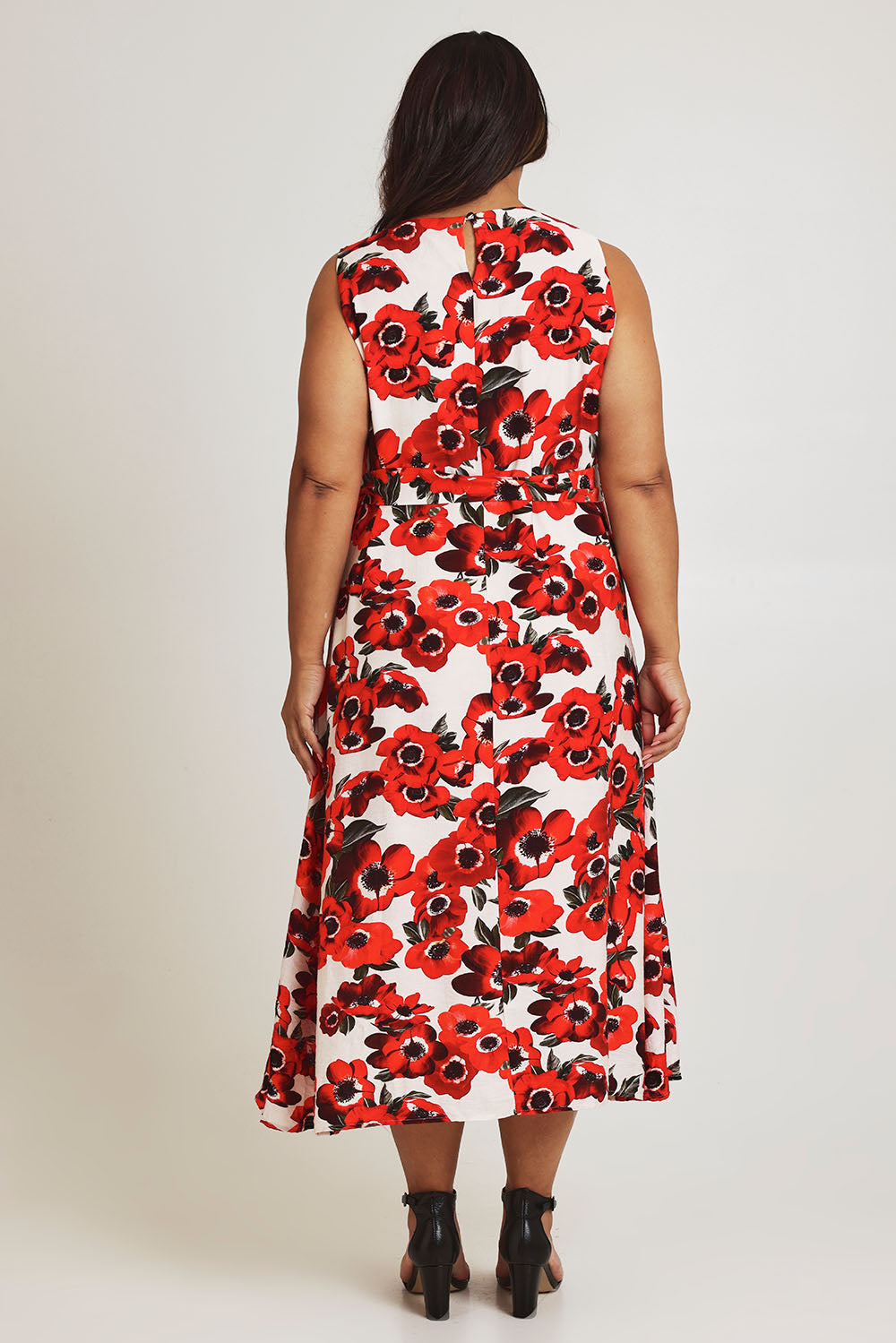 Model Ashleigh wearing size 16 of The Printed V Neck Dress With Sash in colour Redfloral (Red), from the back