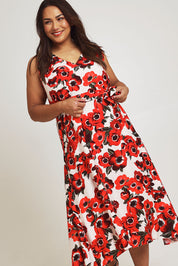 Model Ashleigh wearing size 16 of The Printed V Neck Dress With Sash in colour Redfloral (Red), from the front, cropped image