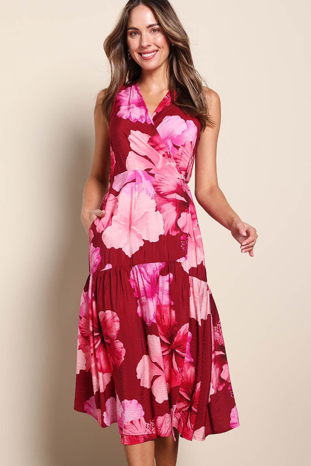 Model Madelinec wearing size 10 of the The Printed Sleeveless Wrap Dress - Pinkhibiscus in colour Pinkhibiscus, in a cropped view