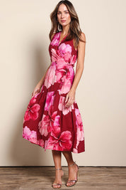 Model Madelinec wearing size 10 of the The Printed Sleeveless Wrap Dress - Pinkhibiscus in colour Pinkhibiscus, from the front