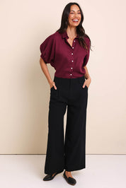 Model Amandam wearing size 10 of the The Linen Blend Tailored Pant - Black in colour Black, from the front