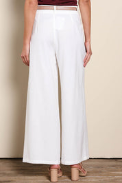 Model Madelinec wearing size 10 of the The Linen Blend Tailored Pant - Snow in colour Snow, from the back