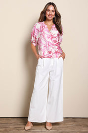 Model Madelinec wearing size 10 of the The Linen Blend Tailored Pant - Snow in colour Snow, from the front