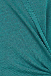 Product shot of the The All Season Faux Wrap Knit Dress – Jewel in colour Jewel, showing detail