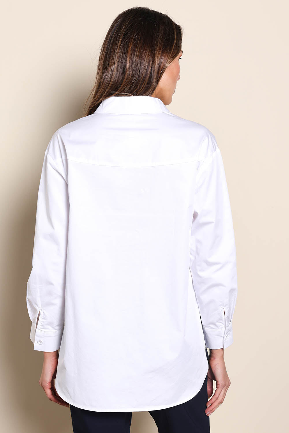 Model Madelinec wearing size 10 of the The Luxe Cotton Popover Shirt – White in colour White, from the back