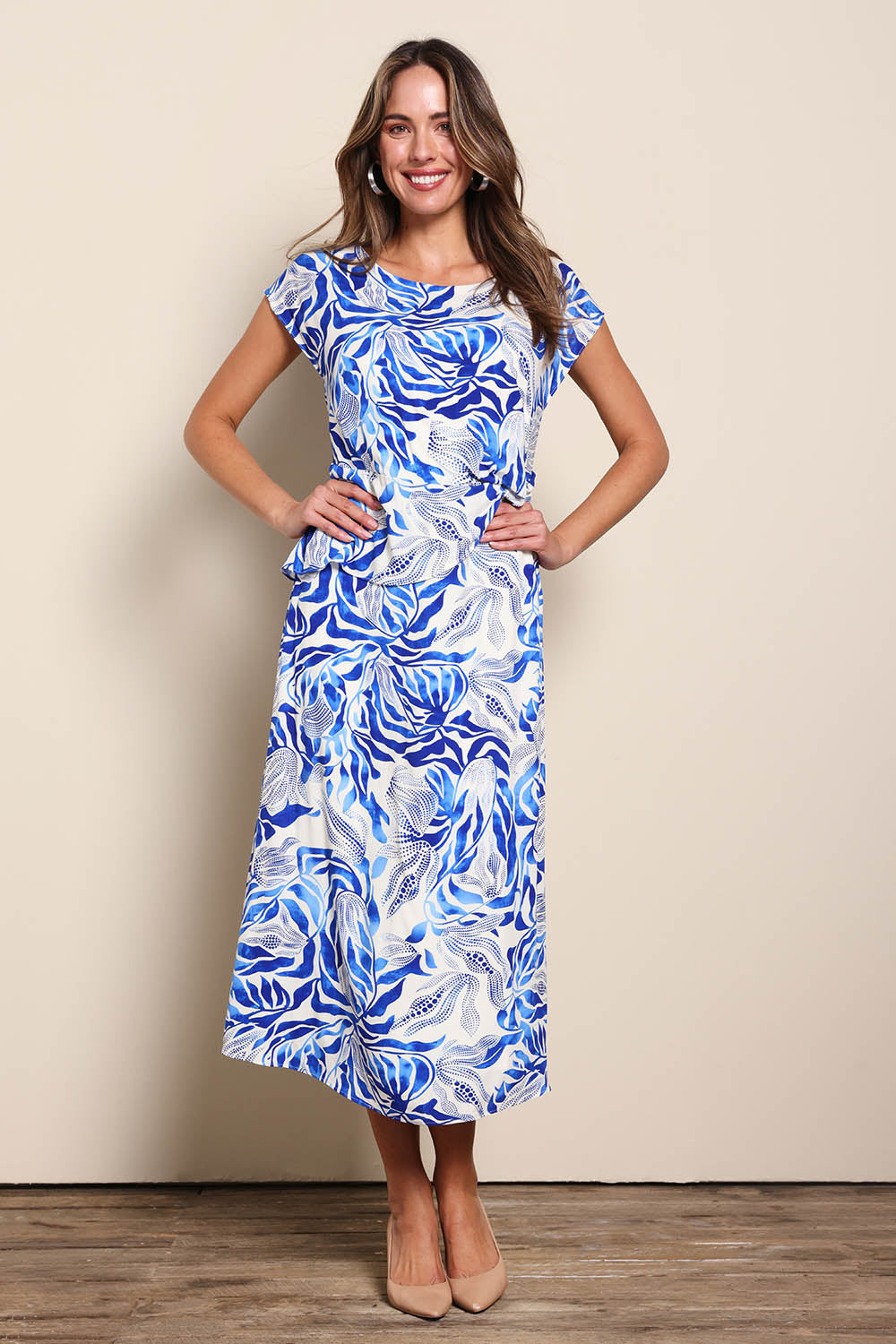 Model Madelinec wearing size 10 of the The Printed Popover Dress - Bluebloom in colour Bluebloom, from the front
