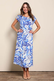 Model Madelinec wearing size 10 of the The Printed Popover Dress - Bluebloom in colour Bluebloom, from the front