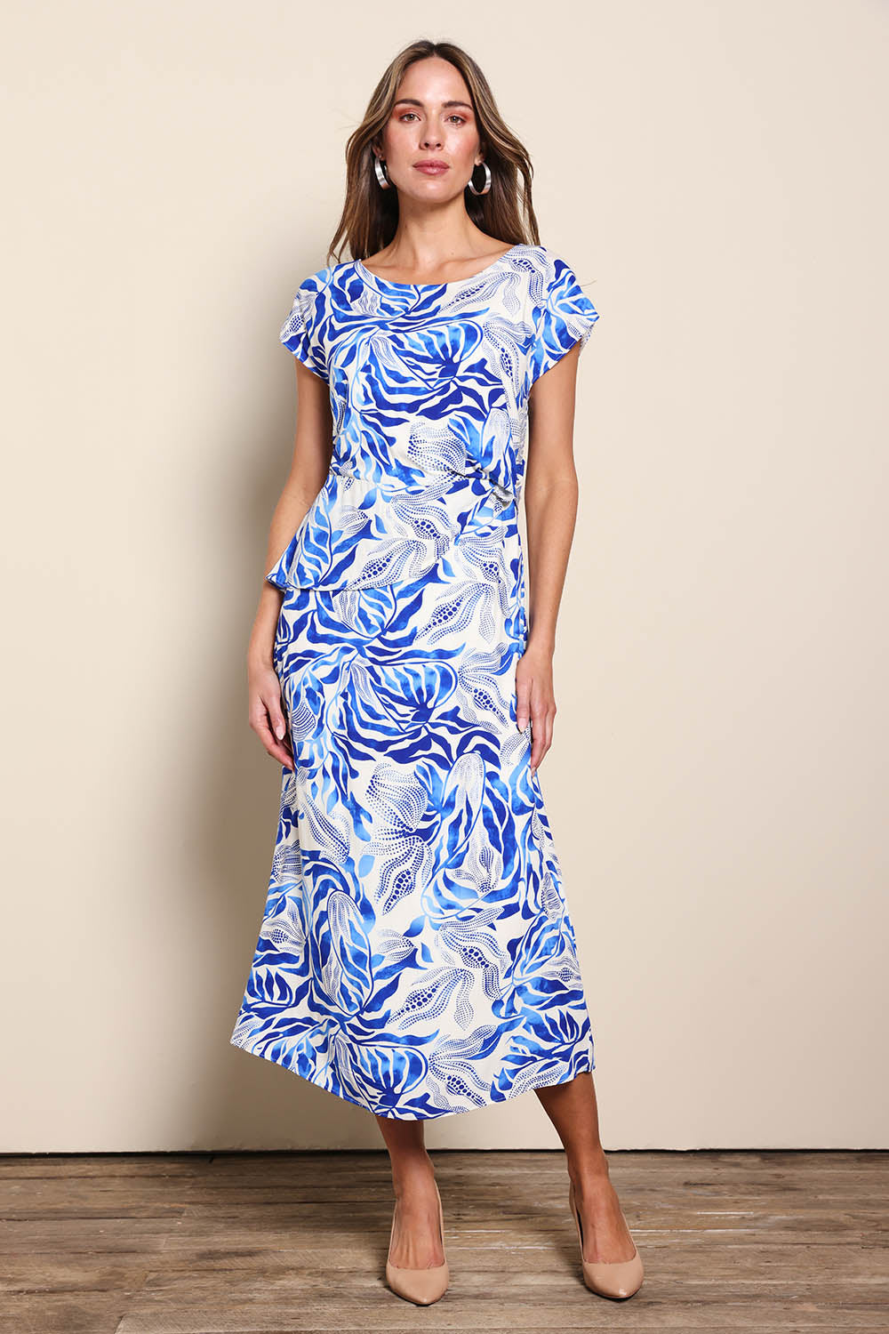 Model Madelinec wearing size 10 of the The Printed Popover Dress - Bluebloom in colour Bluebloom, from the front
