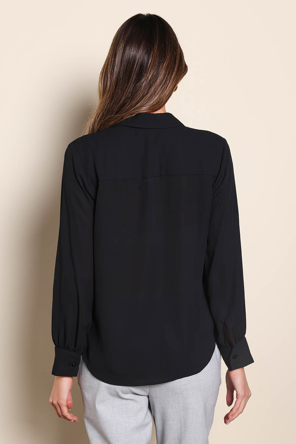 Model Madelinec wearing size 10 of the The Allure Georgette Shirt – Black in colour Black, from the back