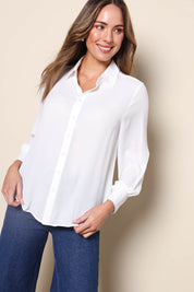 Model Madelinec wearing size 10 of the The Allure Georgette Shirt – Ivory in colour Ivory, in a cropped view