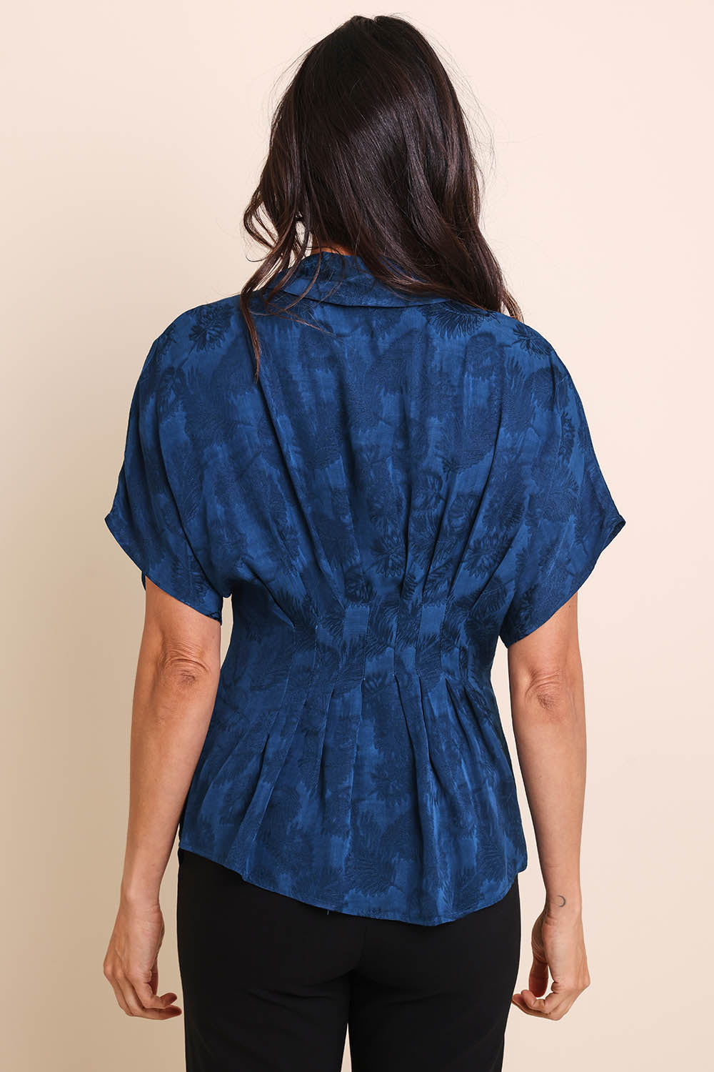 Model Amandam wearing size 10 of the The Jacquard Pleated Shirt - Darkpeacock in colour Darkpeacock, from the back