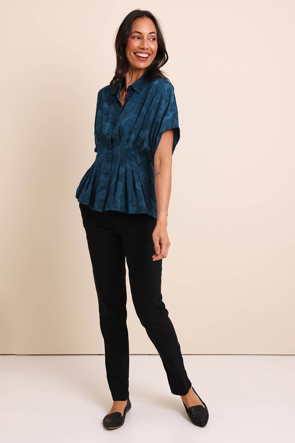 Model Amandam wearing size 10 of the The Jacquard Pleated Shirt - Darkpeacock in colour Darkpeacock, from the front