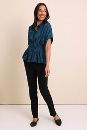 Model Amandam wearing size 10 of the The Jacquard Pleated Shirt - Darkpeacock in colour Darkpeacock, from the front