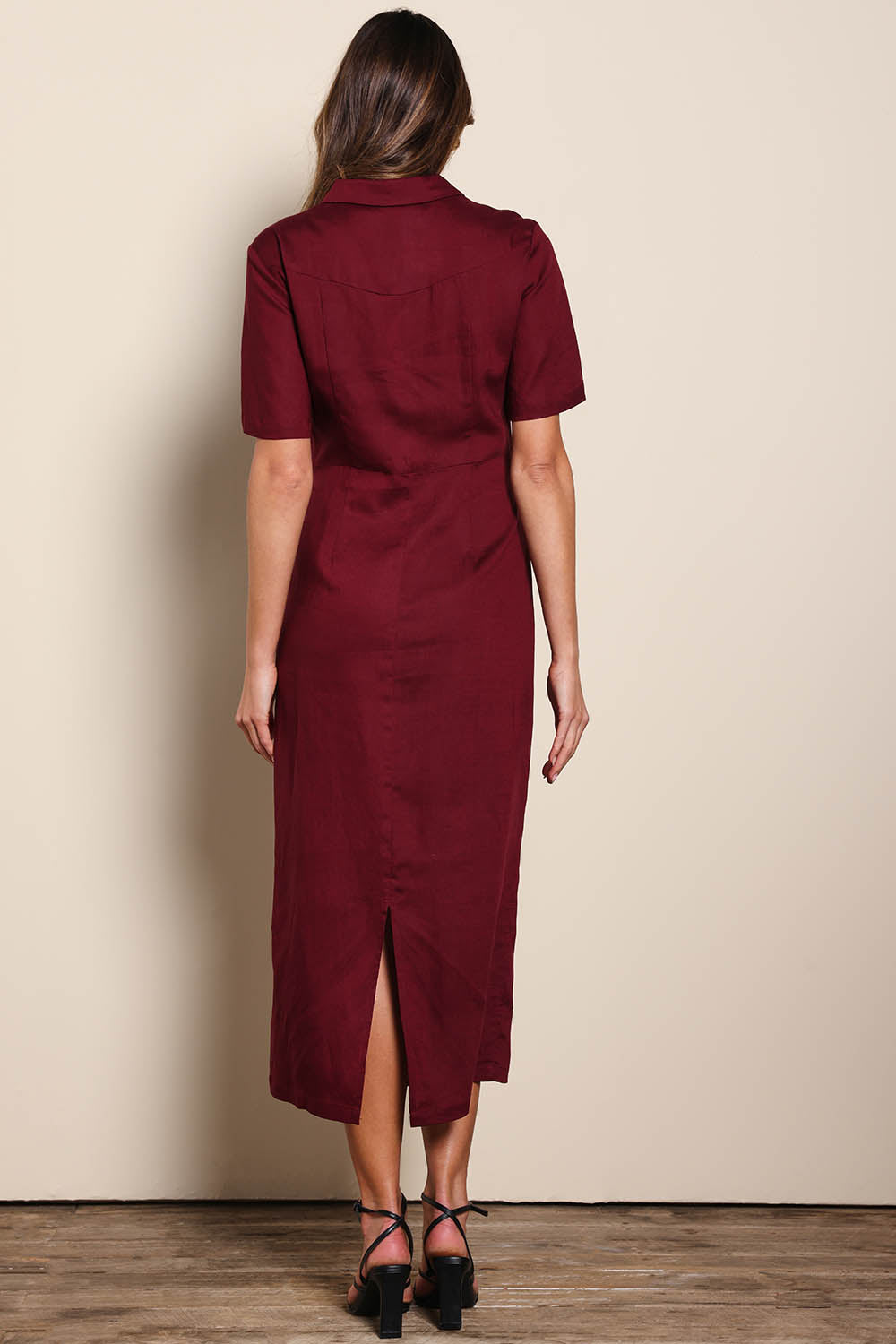 Model Madelinec wearing size 10 of the The Linen Tencel Modish Dress - Burgundy in colour Burgundy, from the front
