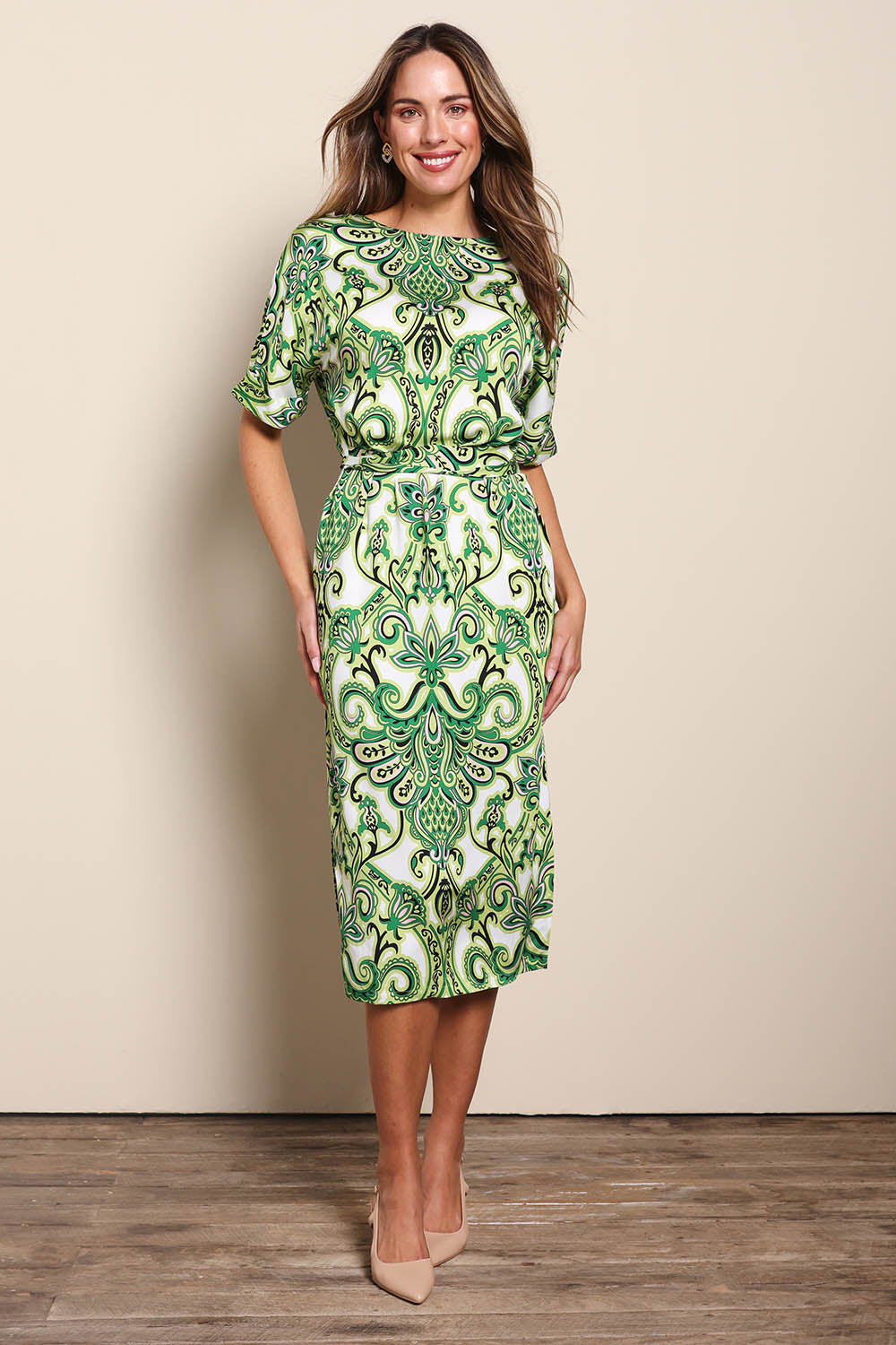 Model Madelinec wearing size 10 of the The Luxe Printed Kimono Sleeve Dress - Green in colour Green, from the front