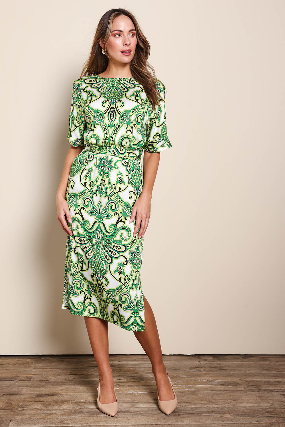 Model Madelinec wearing size 10 of the The Luxe Printed Kimono Sleeve Dress - Green in colour Green, from the front
