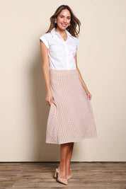 Model Madelinec wearing size 10 of the The Bias Panel Check Skirt - Sand in colour Sand, from the front