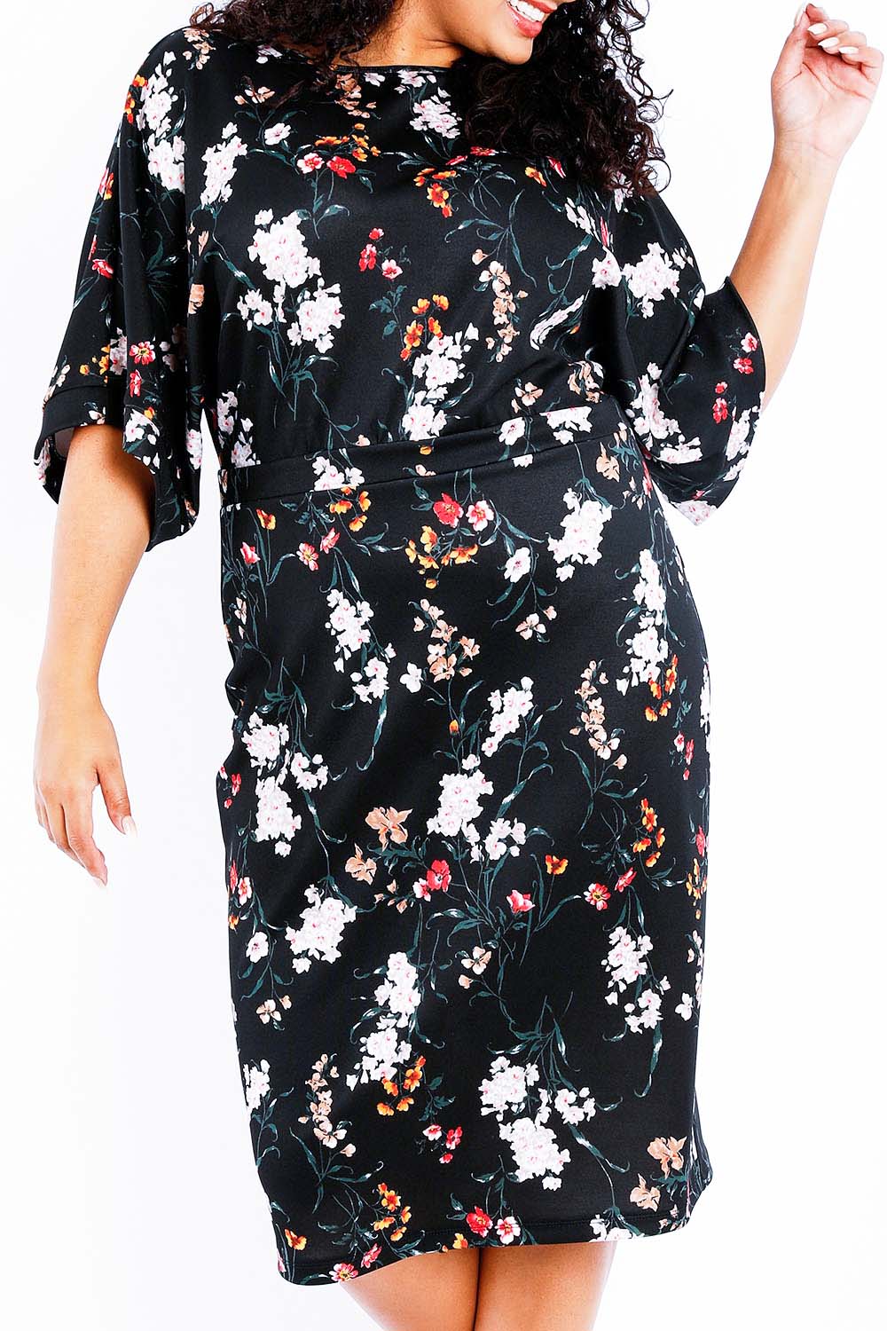 Model Sasha-Lee wearing size 16 of The Printed Kimono Sleeve Pencil Dress in colour Garden (Black), from the front, cropped image