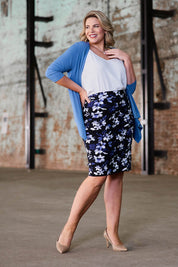 Model Fiona wearing size 16 of The Tube Skirt in colour Fleur (Blue), from the front, showing the whole outfit