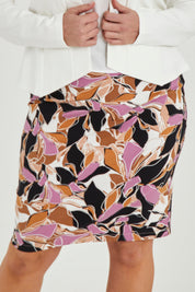 Model Maddy wearing size 16 of The Tube Skirt in colour Abstract, from the front, cropped image