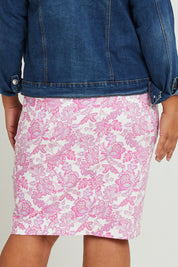 Model Ashleigh wearing size 16 of The Tube Skirt in colour Pinkfleur (Pink), from the back