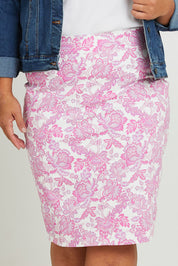 Model Ashleigh wearing size 16 of The Tube Skirt in colour Pinkfleur (Pink), from the front, cropped image