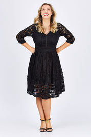 Model Jess wearing size 14 of The 3/4 Sleeve Lace Dress in colour Black (Black), from the front, showing the whole outfit