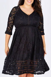 Model Mae wearing size 18 of The 3/4 Sleeve Lace Dress in colour Black (Black), from the front, cropped image