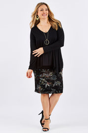 Model Ljubenka wearing size 16 of the Belle V Neck Forgiver Tunic in colour Black (Black), from the front, showing the whole outfit