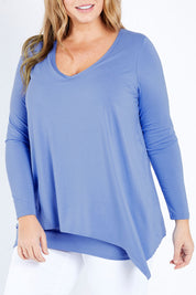 Model Fiona wearing size 16 of the Belle V Neck Forgiver Tunic in colour Bluebonnet (Blue), from the front, cropped image