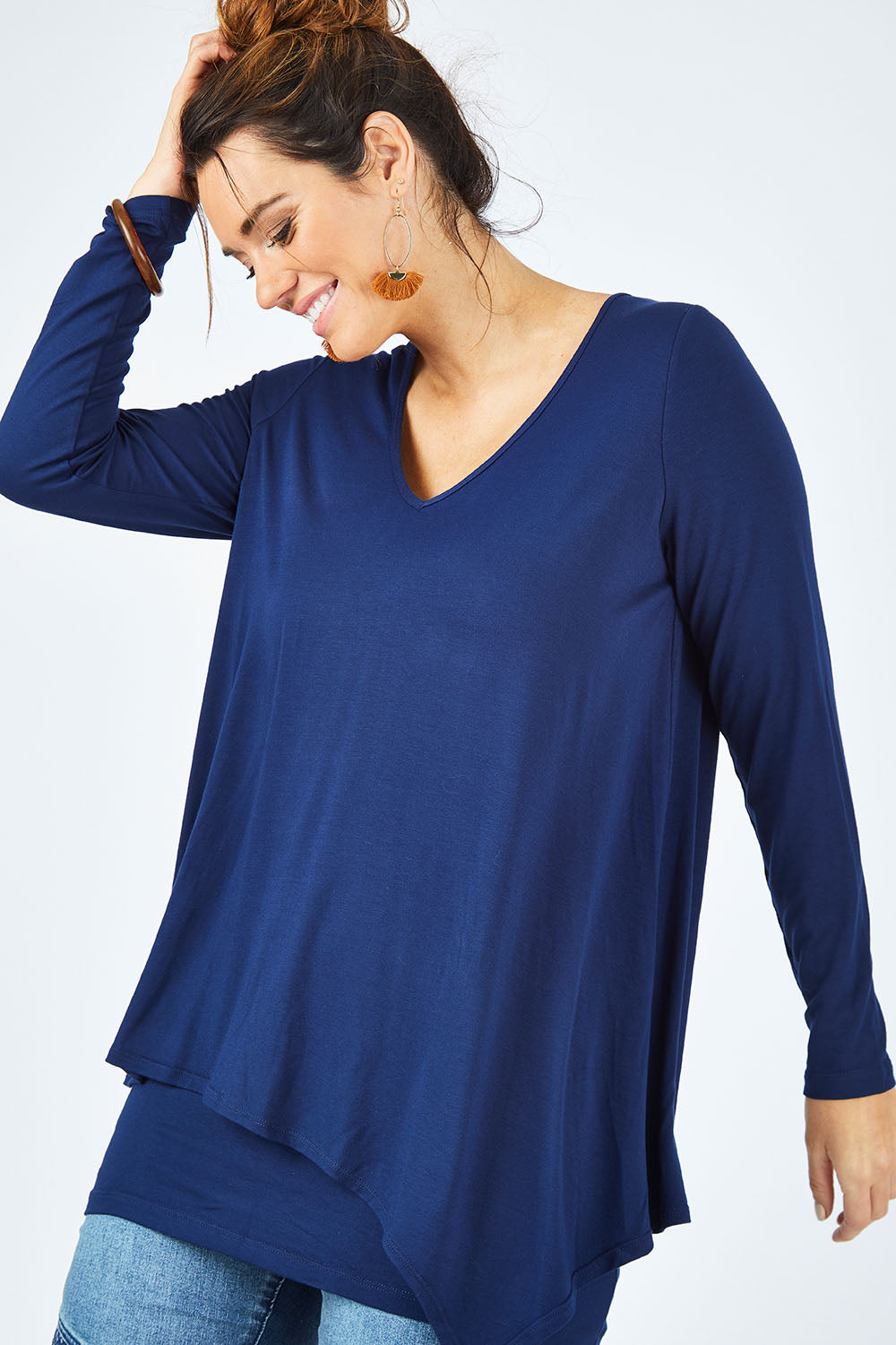 Model Laura wearing size 12 of the Belle V Neck Forgiver Tunic in colour Navy (Blue), from the front, cropped image
