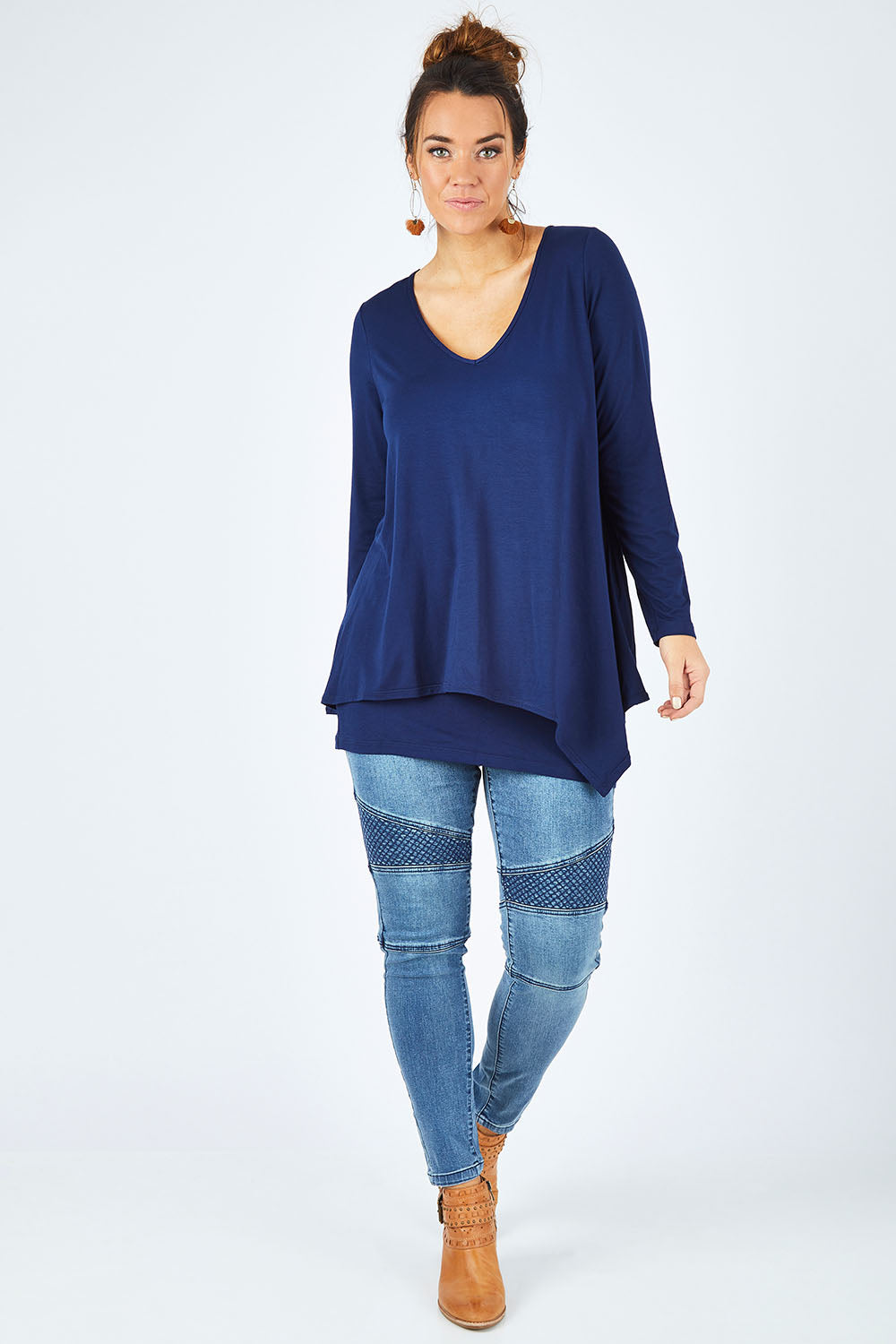 Model Laura wearing size 12 of the Belle V Neck Forgiver Tunic in colour Navy (Blue), from the front, showing the whole outfit