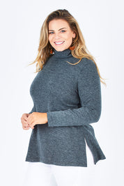 Model Fiona wearing size 16 of the Belle Cowl Swing Sweater in colour Green (Green), from the front, cropped image