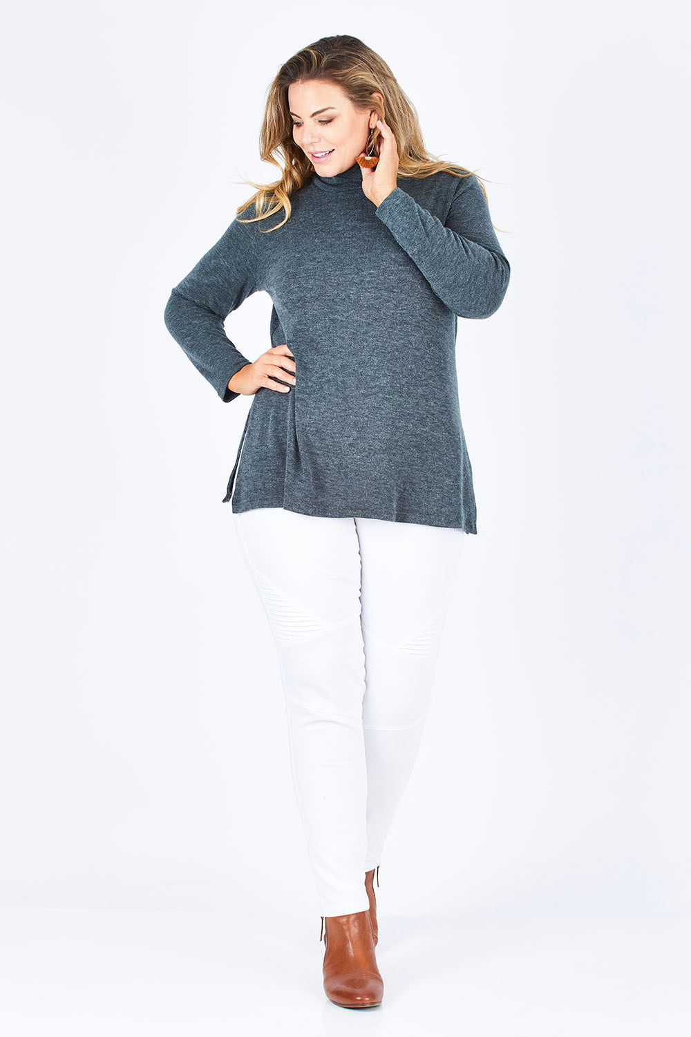 Model Fiona wearing size 16 of the Belle Cowl Swing Sweater in colour Green (Green), from the front, showing the whole outfit