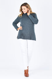 Model Fiona wearing size 16 of the Belle Cowl Swing Sweater in colour Green (Green), from the front, showing the whole outfit