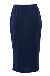 Product shot of the Belle Textured Pencil Skirt in colour Navy (Blue), from the back