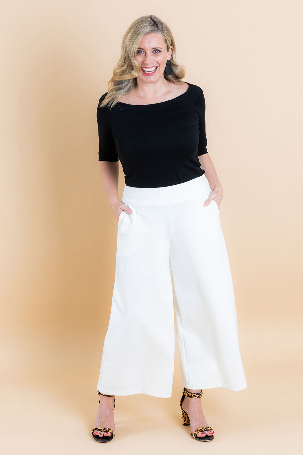 Model Brooke wearing size 10 of the Belle Half Sleeve Boat Tee in colour Black (Black), from the front, showing the whole outfit