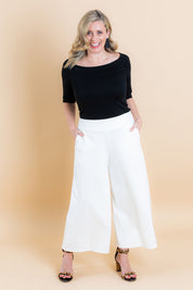 Model Brooke wearing size 10 of the Belle Half Sleeve Boat Tee in colour Black (Black), from the front, showing the whole outfit