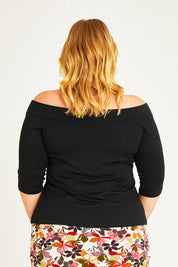 Model Caitlin wearing size 20 of the Belle Half Sleeve Boat Tee in colour Black (Black), from the back