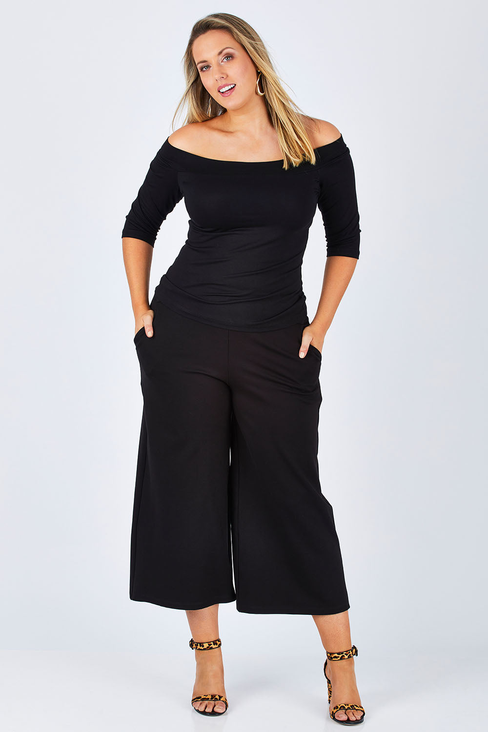 Model Jess wearing size 12 of the Belle Half Sleeve Boat Tee in colour Black (Black), from the front, showing the whole outfit