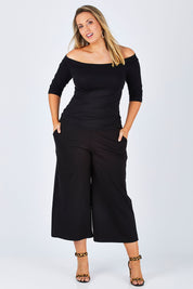 Model Jess wearing size 12 of the Belle Half Sleeve Boat Tee in colour Black (Black), from the front, showing the whole outfit