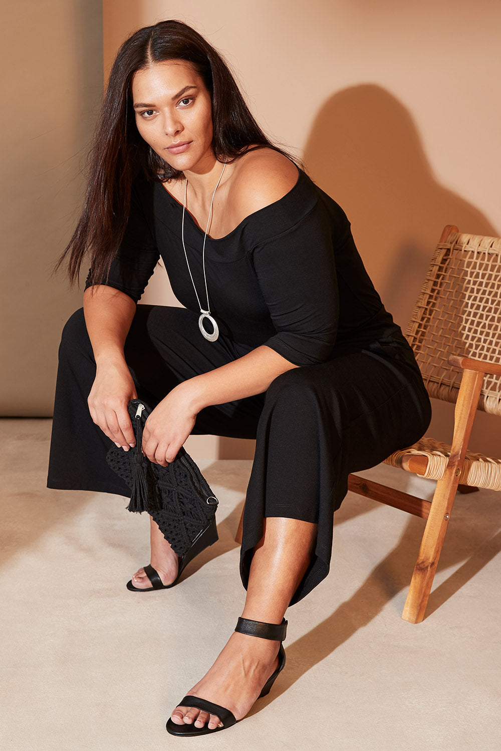 Model Lauren wearing size 16 of the Belle Half Sleeve Boat Tee in colour Black (Black), from the front, showing the whole outfit