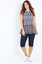 Model Laura wearing size 12 of the Belle Knee Short in colour Navy (Blue), from the front, showing the whole outfit