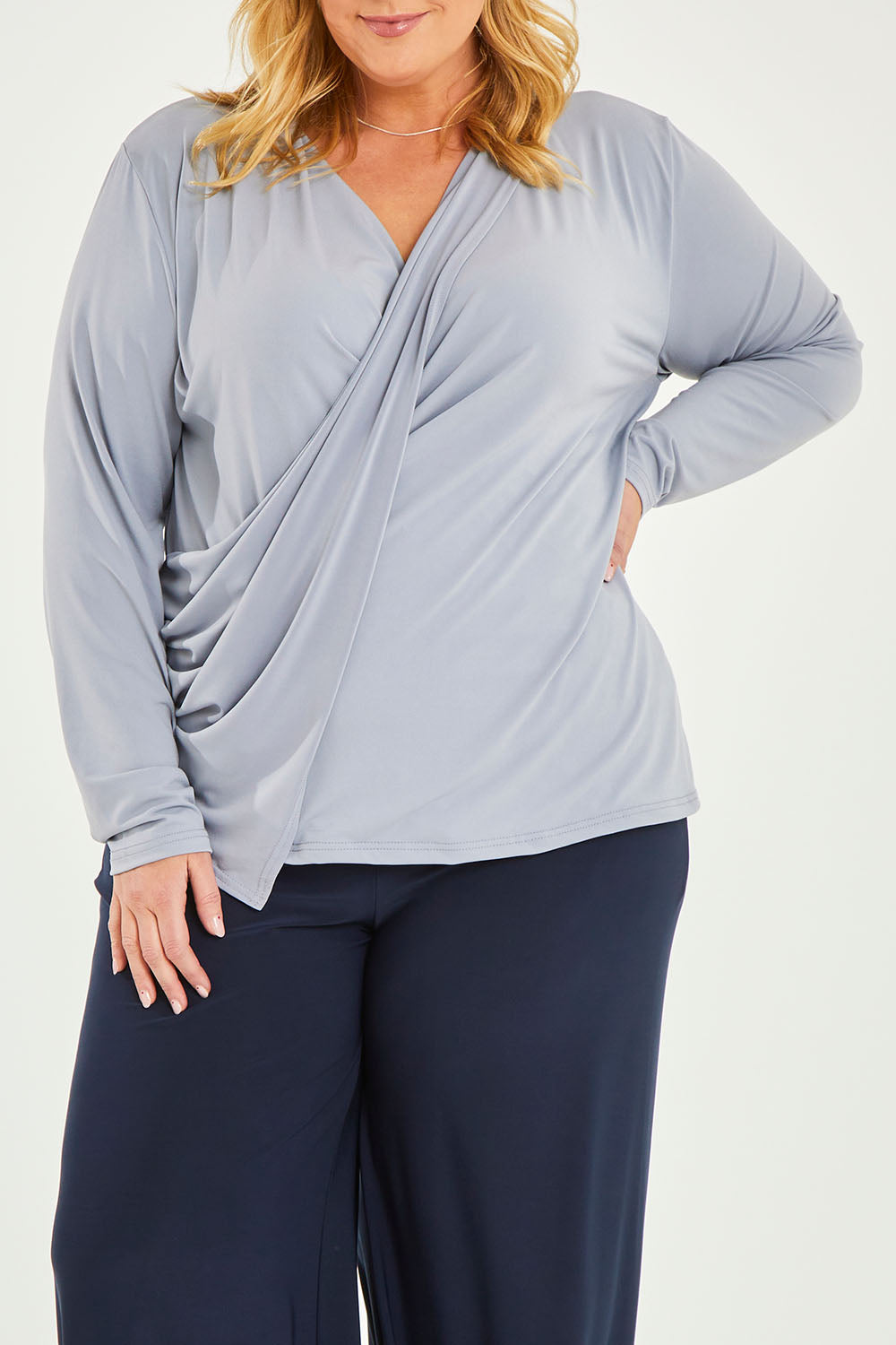 Model Caitlin wearing size 20 of the Belle Drape Tee in colour Sliver (Grey), from the front, cropped image