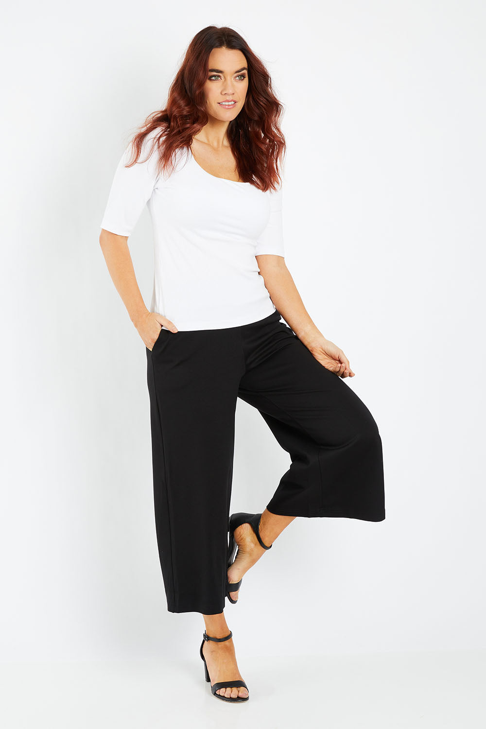 Model Laura wearing size 12 of the Belle Palazzo Ponte Crop in colour Black (Black), from the front, showing the whole outfit