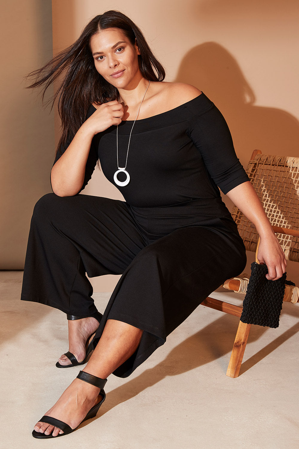 Model Lauren wearing size 16 of the Belle Palazzo Ponte Crop in colour Black (Black), from the front, showing the whole outfit