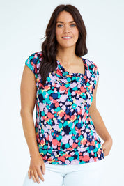 Model Laura wearing size 12 of the Belle Printed Knit Square Neck Top in colour Vibrant (Blue), from the front, cropped image