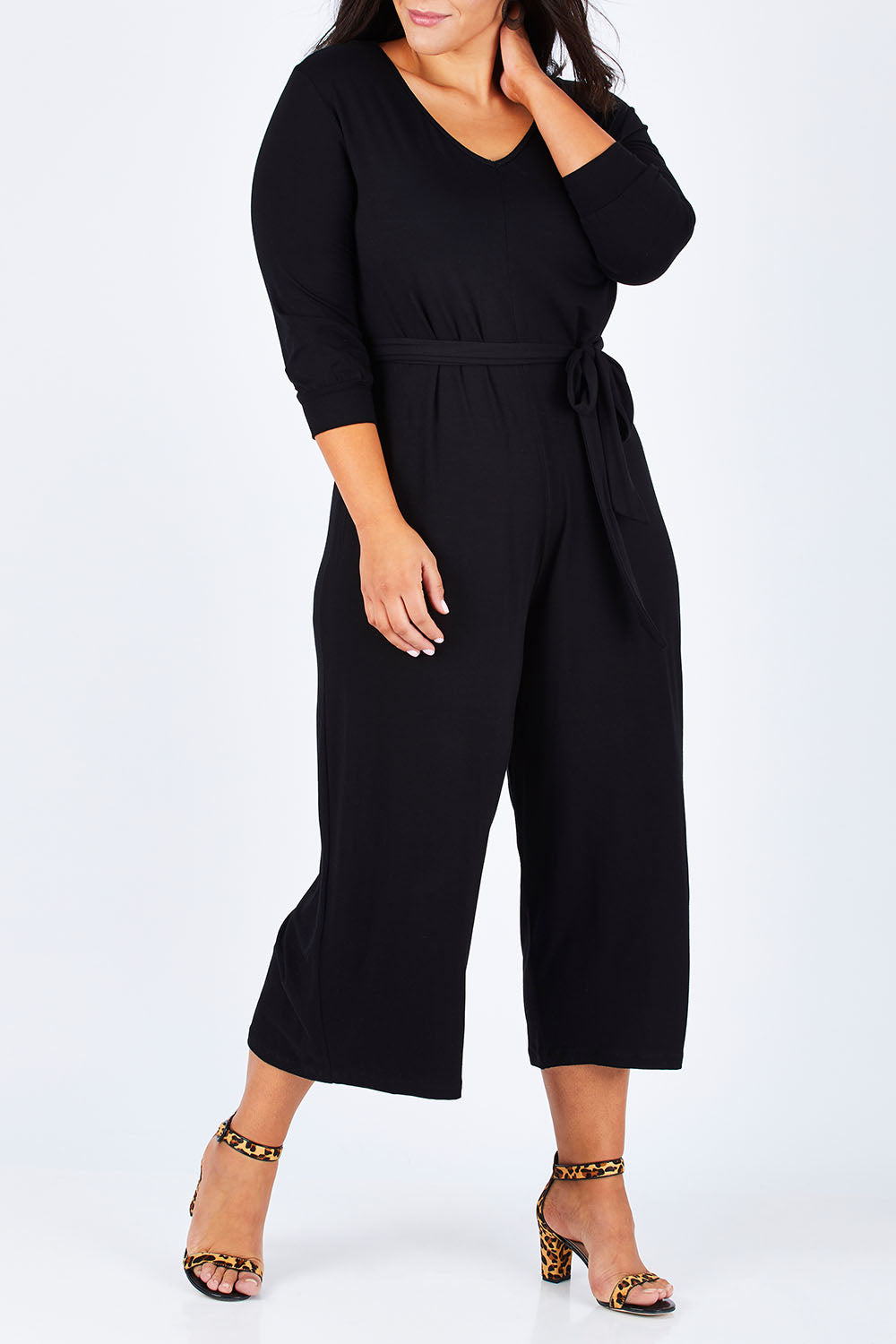 Model Lauren wearing size 16 of the Belle 7/8 Sleeve Knit Jumpsuit With Self Belt in colour Black (Black), from the front, cropped image