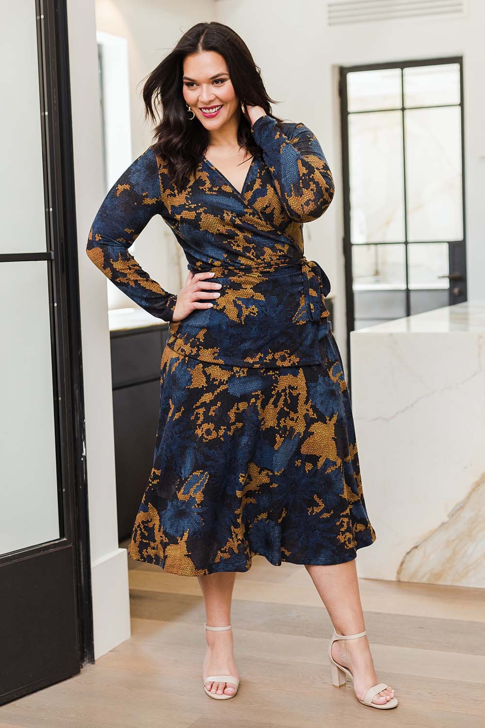 Model Lauren wearing size 16 of the Belle Python Knit Full Skirt in colour Python (Blue), from the front, showing the whole outfit